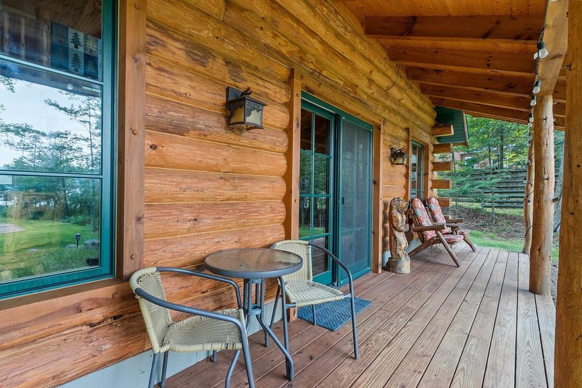 Experience true Northwoods living in this beautiful full log - photo 9