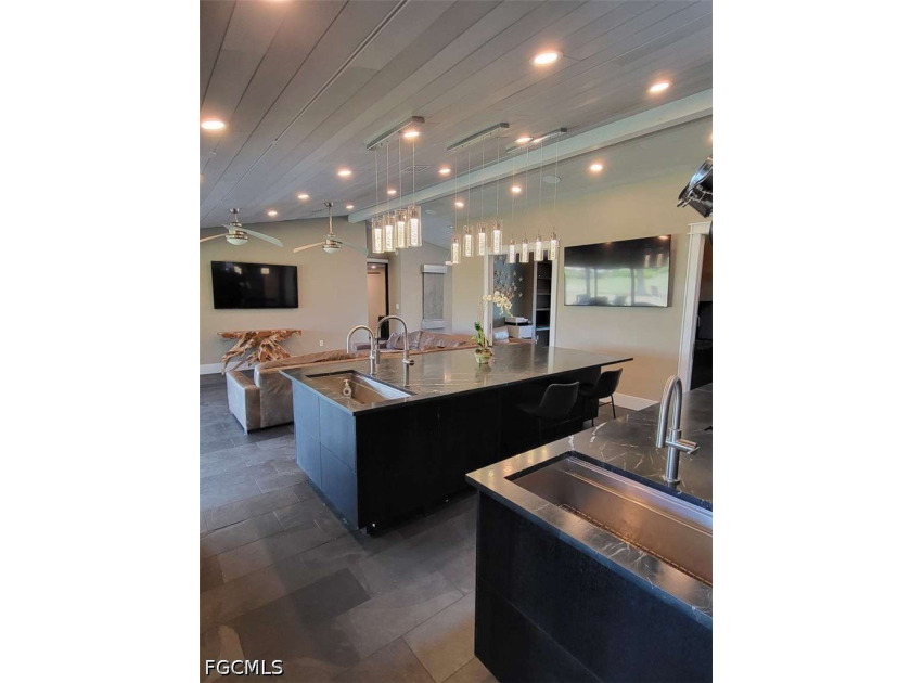Experience refined Naples living in this beautifully updated - photo 2