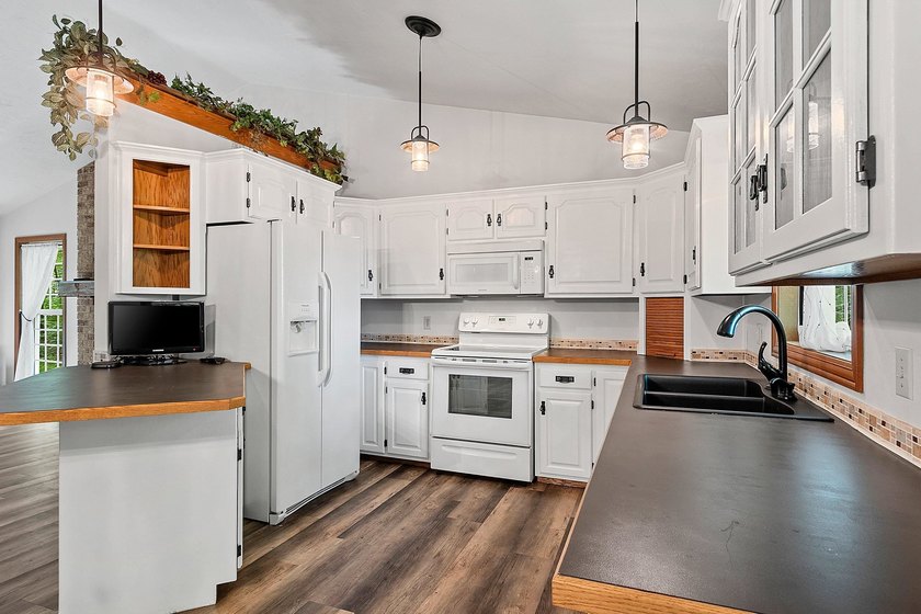 Situated on beautiful McCauslin Brook Golf Course, this well - photo 7