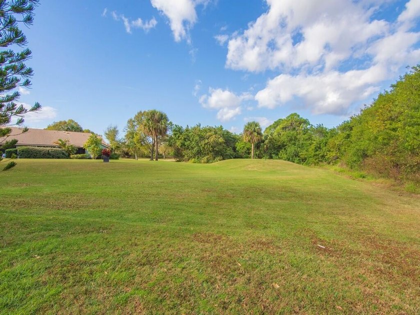 Located on the 5th tee at Gator Trace CC, this beautiful villa - photo 31