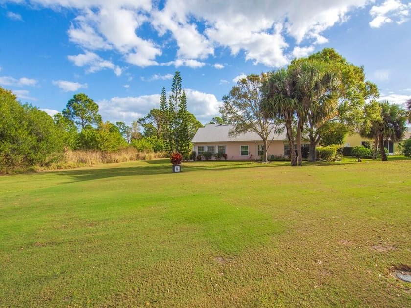 Located on the 5th tee at Gator Trace CC, this beautiful villa - photo 35
