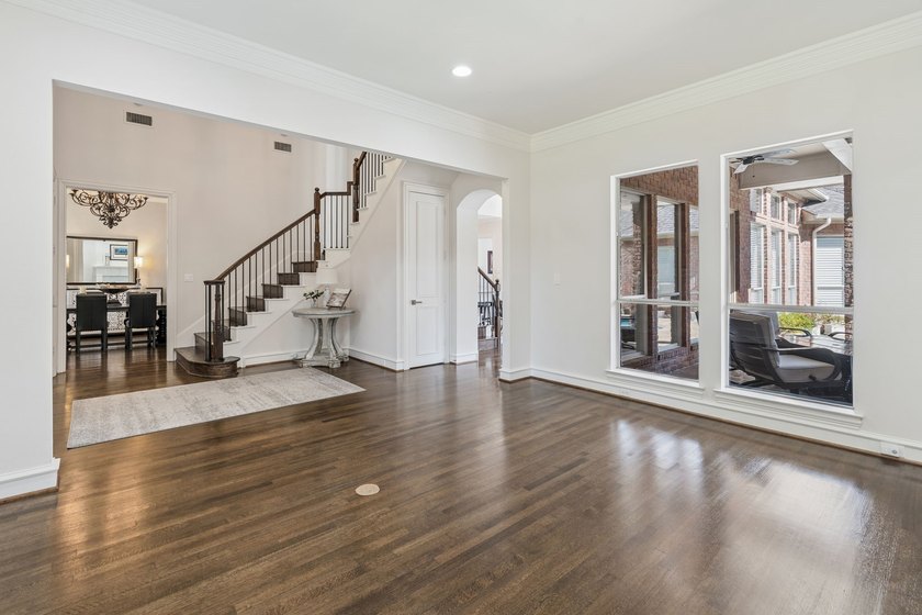 Welcome to this stunning two-story brick home nestled in the - photo 3