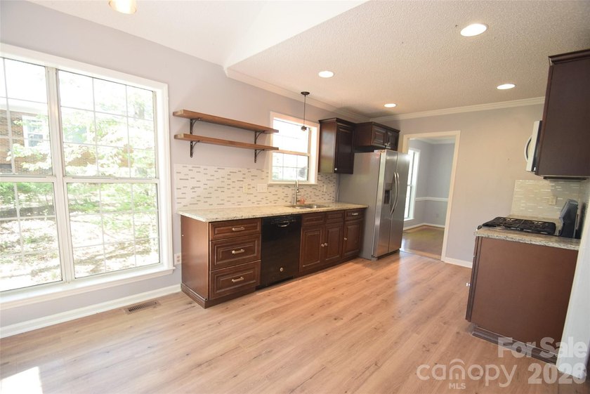 Improved pricing! Welcome to this 1.5-story home offering both - photo 12