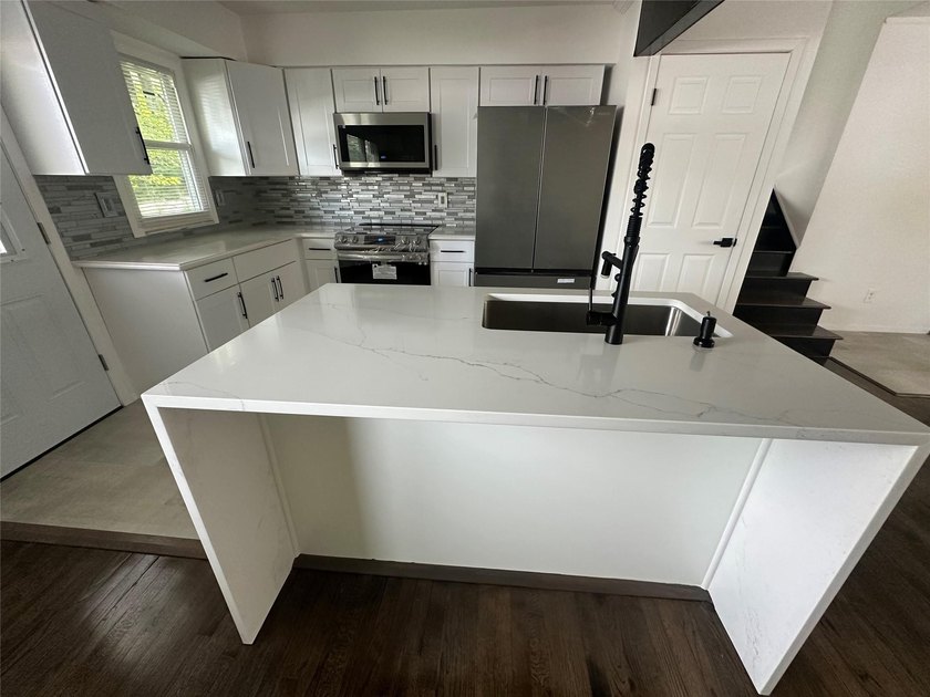 ISLIP School District. This split-level Newly Renovated Home has - photo 13