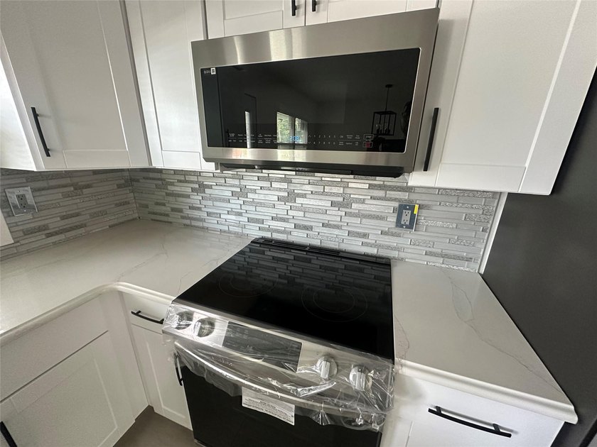 ISLIP School District. This split-level Newly Renovated Home has - photo 15