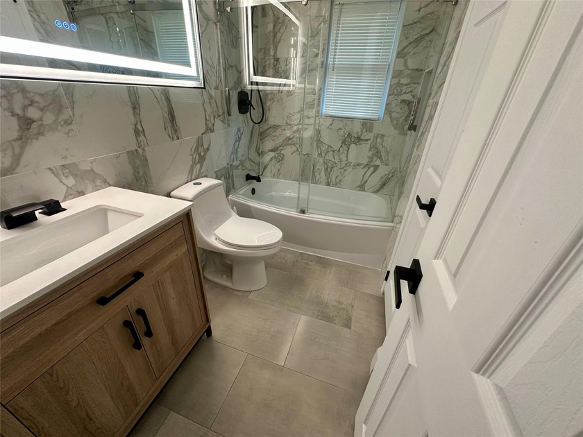 ISLIP School District. This split-level Newly Renovated Home has - photo 21
