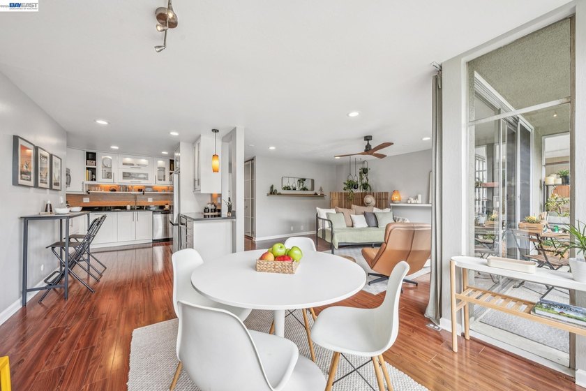 Perched on the top floor, this bright and stylishly upgraded - photo 12