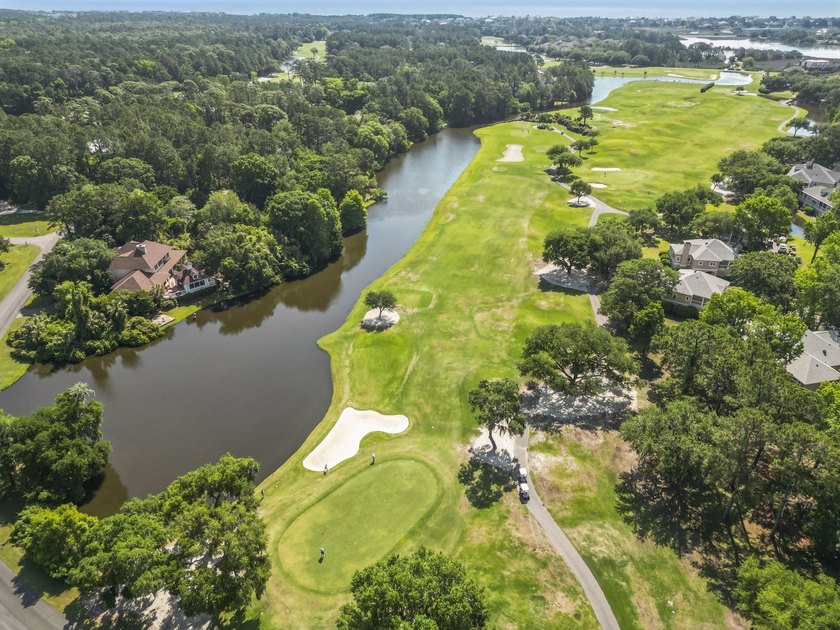 Buildable 0.51-acre pond-view homesite on Colony Club Drive in - photo 11