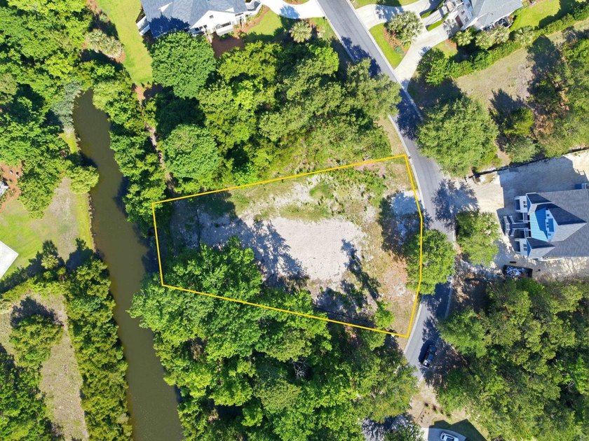 Buildable 0.51-acre pond-view homesite on Colony Club Drive in - photo 12