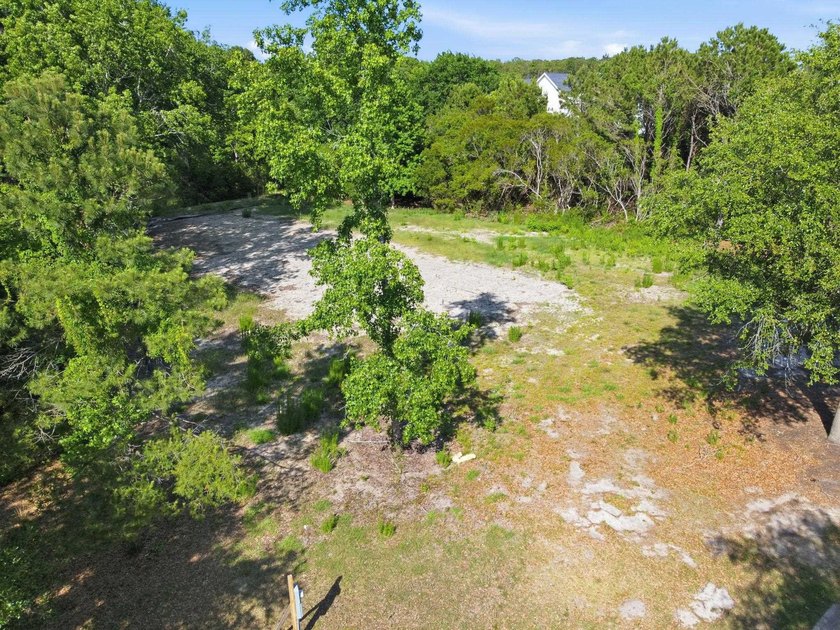 Buildable 0.51-acre pond-view homesite on Colony Club Drive in - photo 13