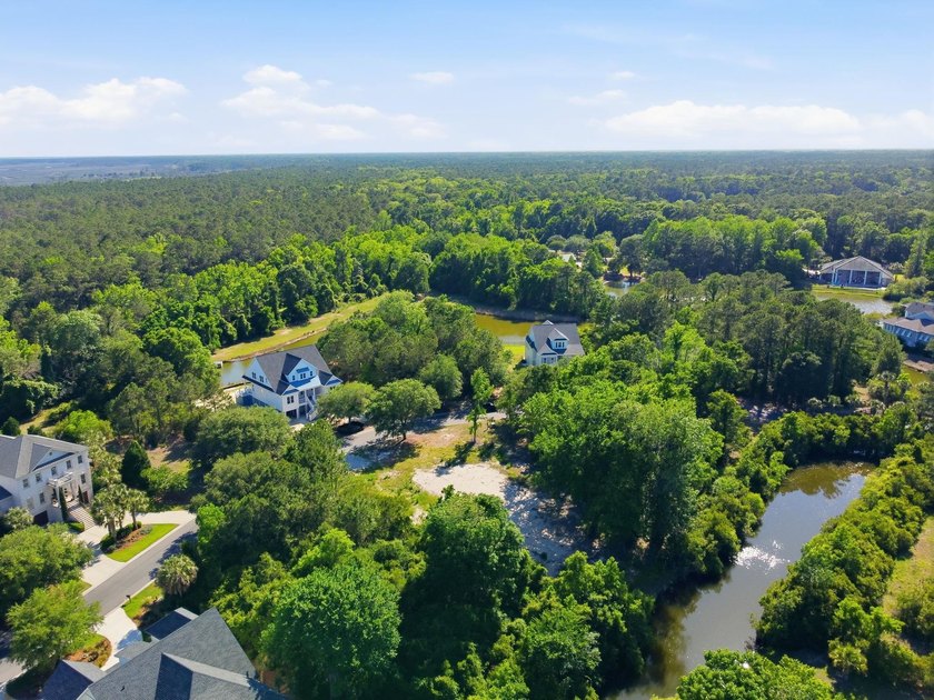 Buildable 0.51-acre pond-view homesite on Colony Club Drive in - photo 17