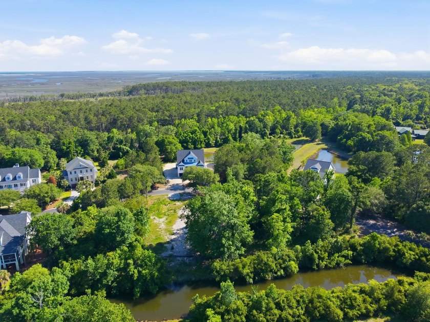 Buildable 0.51-acre pond-view homesite on Colony Club Drive in - photo 18