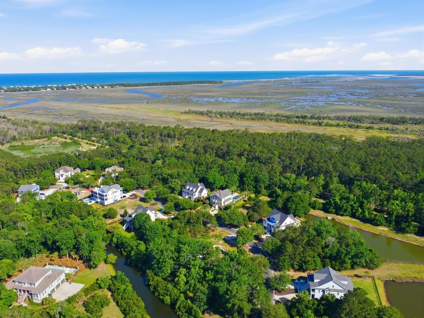 Buildable 0.51-acre pond-view homesite on Colony Club Drive in - photo 21
