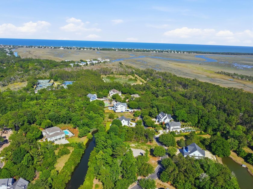 Buildable 0.51-acre pond-view homesite on Colony Club Drive in - photo 22