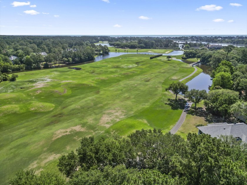 Buildable 0.51-acre pond-view homesite on Colony Club Drive in - photo 27