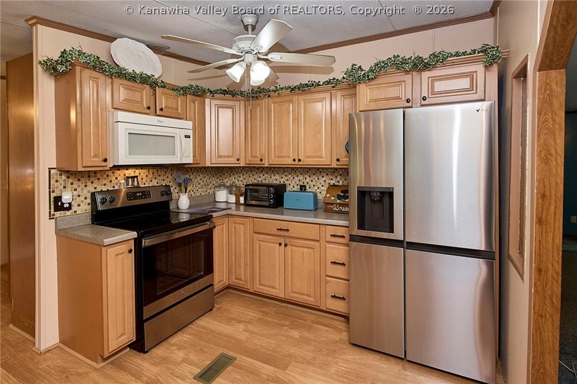 Situated on two acres in rural Milton, this 1996 double-wide - photo 11