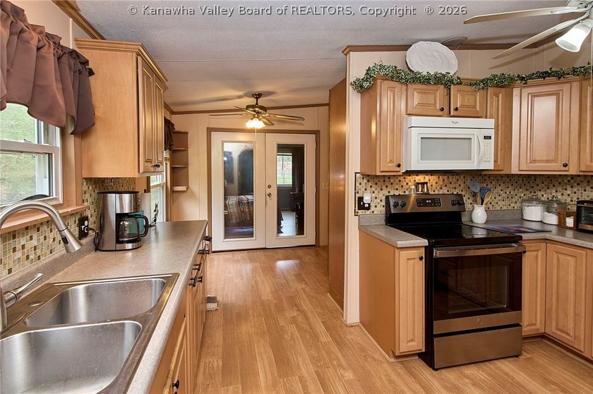 Situated on two acres in rural Milton, this 1996 double-wide - photo 12