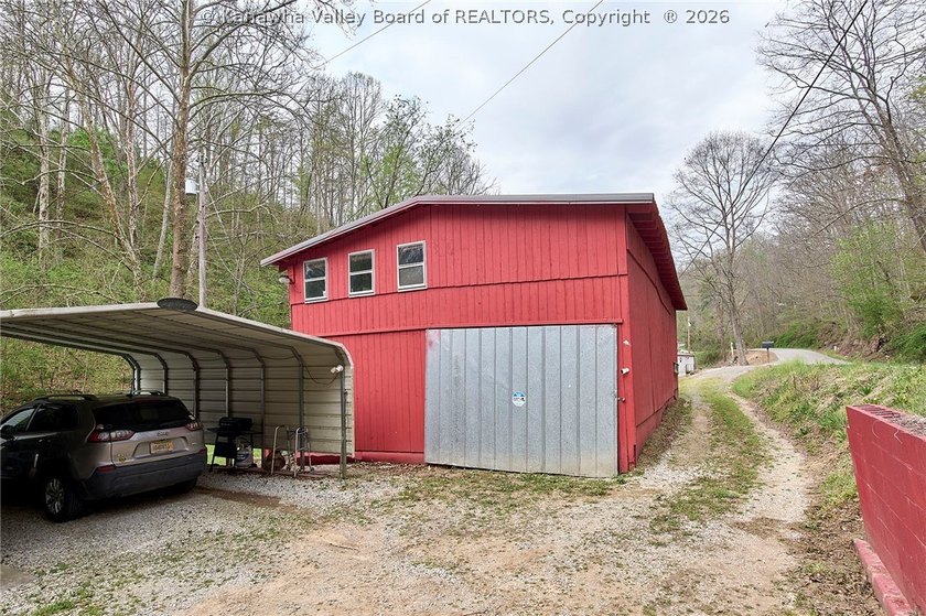 Situated on two acres in rural Milton, this 1996 double-wide - photo 21