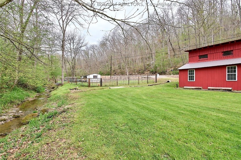 Situated on two acres in rural Milton, this 1996 double-wide - photo 30