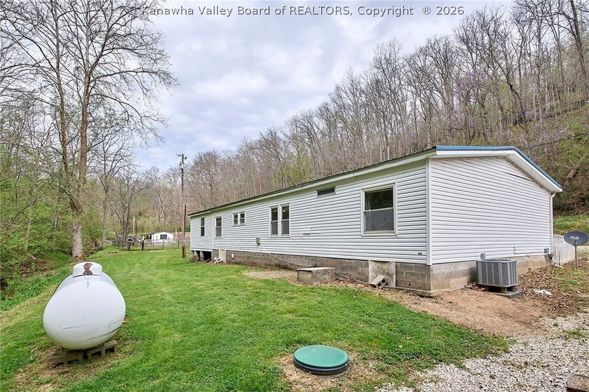 Situated on two acres in rural Milton, this 1996 double-wide - photo 31