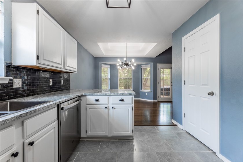 Tucked beneath a mature hardwood canopy in an established - photo 11