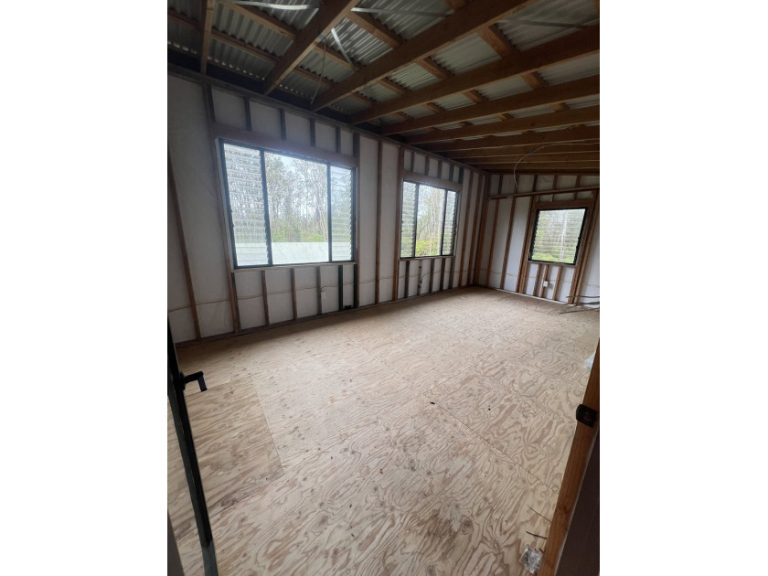 One-acre square corner lot on a paved road offering privacy in a - photo 2