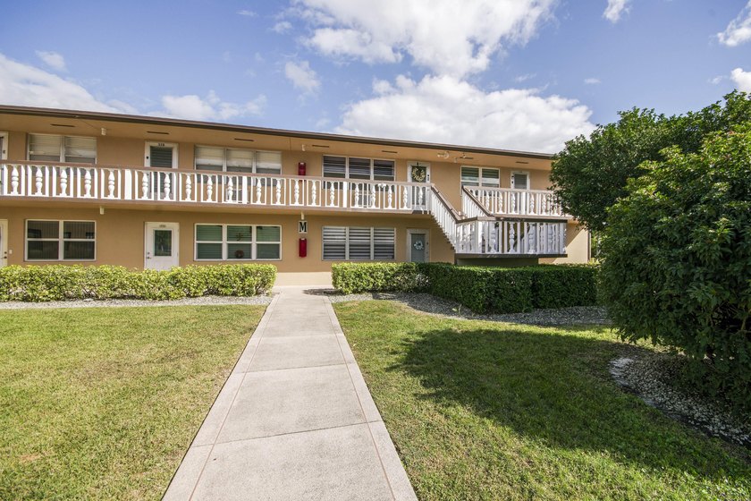Beautifully remodeled 2BR/1.5BA upstairs corner condo with water - photo 11