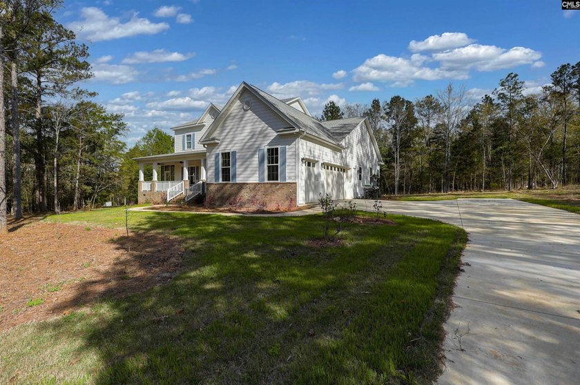 Modern comfort meets relaxed lake living on this spacious 1-acre - photo 2