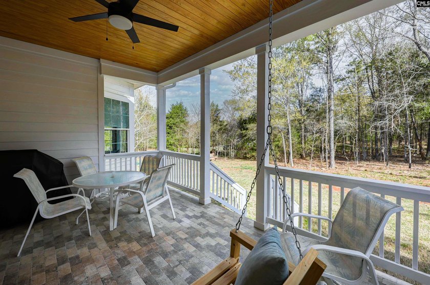 Modern comfort meets relaxed lake living on this spacious 1-acre - photo 5