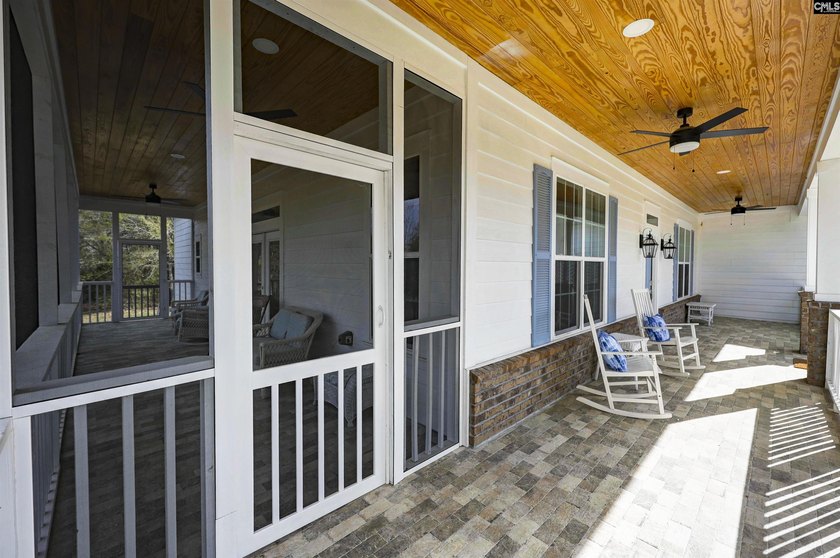 Modern comfort meets relaxed lake living on this spacious 1-acre - photo 7