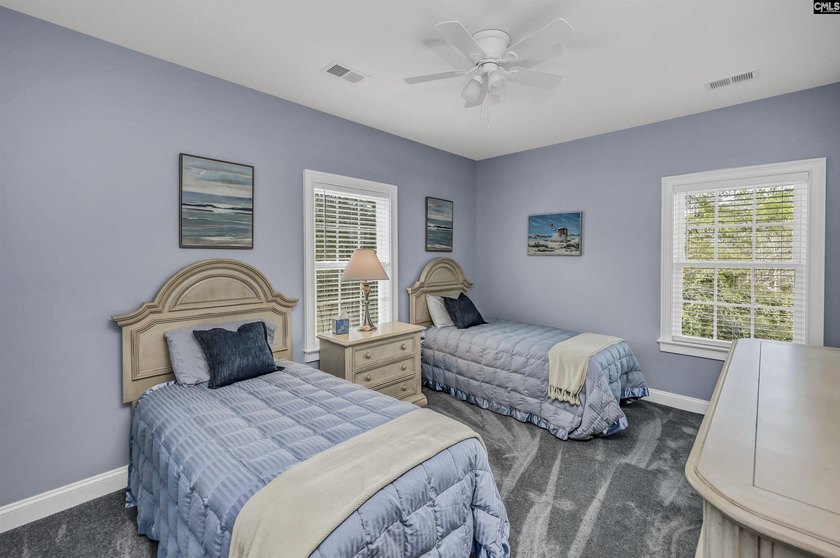 Modern comfort meets relaxed lake living on this spacious 1-acre - photo 9