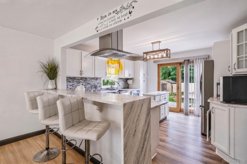 Welcome to this beautifully maintained Expanded Cape nestled in - photo 6