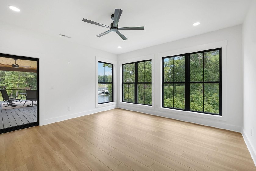 This new construction modern lake home is so fresh the walls - photo 9