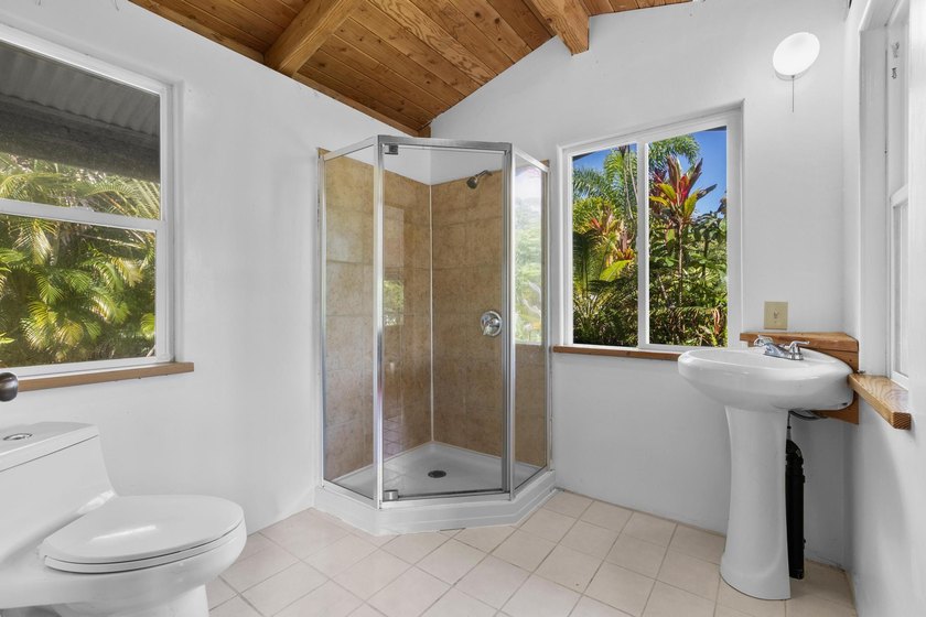 Welcome home to your tropical sanctuary and full blooming fruit - photo 8