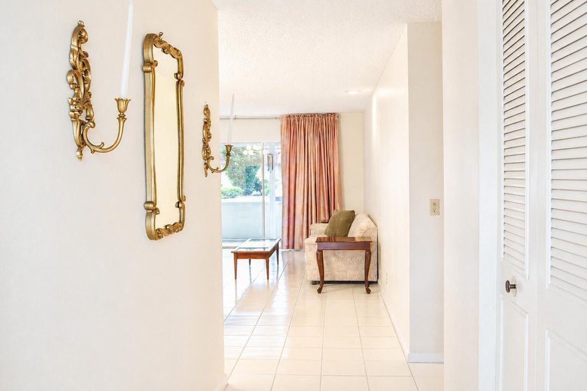 Welcome to this desirable 55+ community End-unit villa in the - photo 6