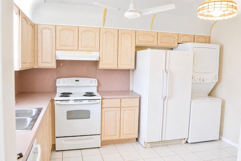 Welcome to this desirable 55+ community End-unit villa in the - photo 7