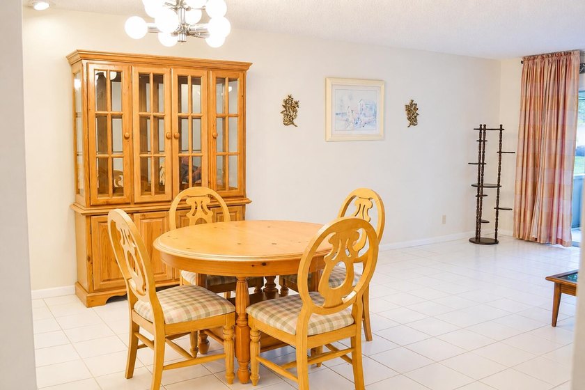 Welcome to this desirable 55+ community End-unit villa in the - photo 10