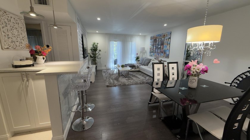 Bright and inviting 1-bedroom, 1.5-bath condo located less than - photo 2