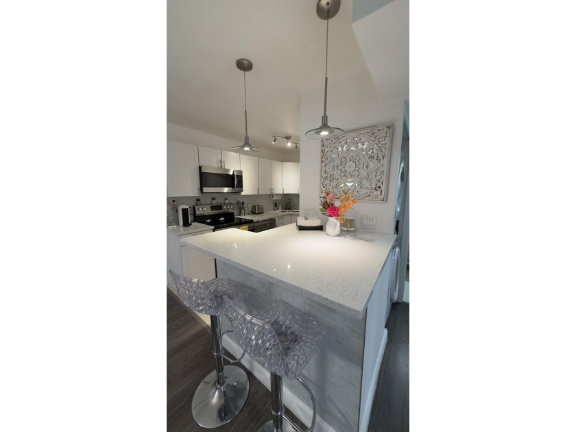 Bright and inviting 1-bedroom, 1.5-bath condo located less than - photo 3
