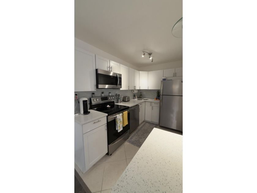 Bright and inviting 1-bedroom, 1.5-bath condo located less than - photo 4