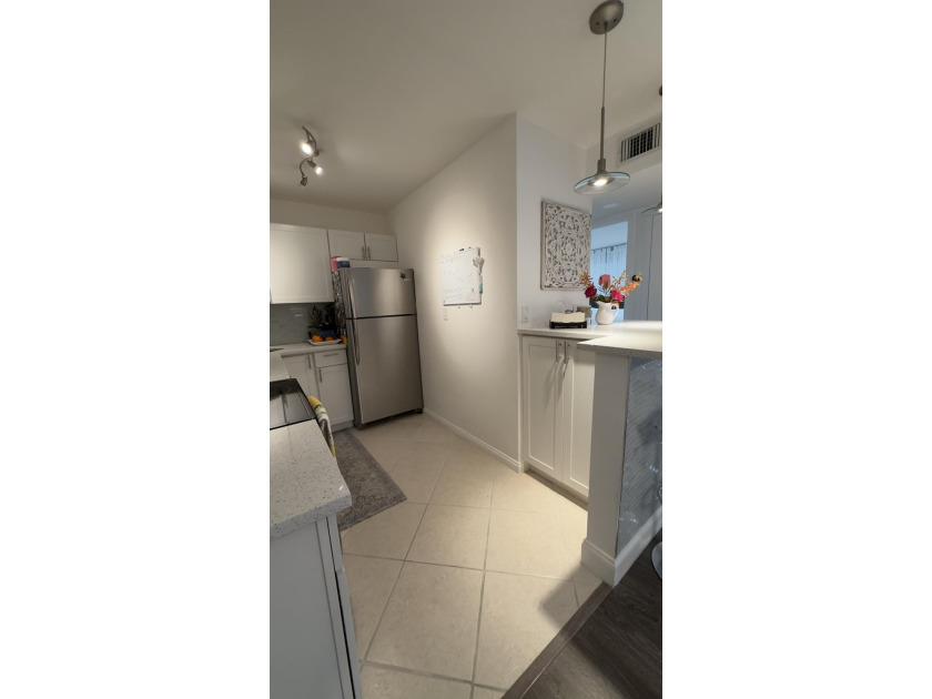 Bright and inviting 1-bedroom, 1.5-bath condo located less than - photo 5