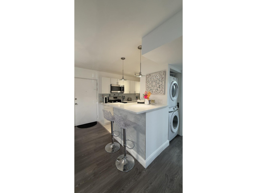Bright and inviting 1-bedroom, 1.5-bath condo located less than - photo 6