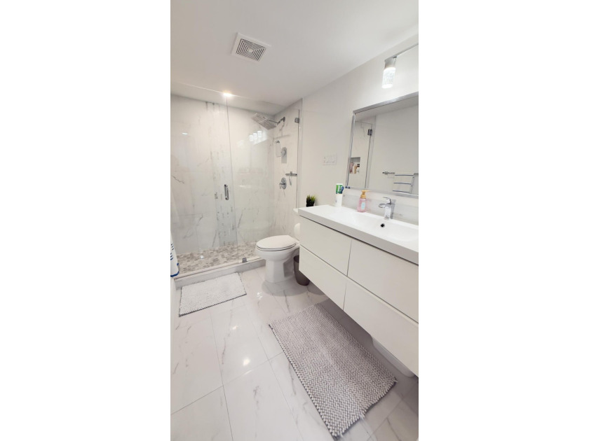 Bright and inviting 1-bedroom, 1.5-bath condo located less than - photo 7