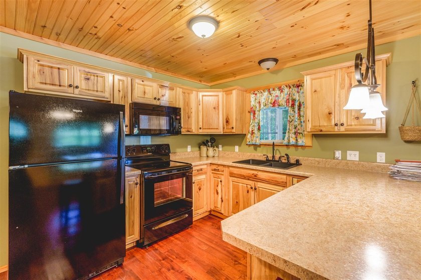 Lake living at its finest! This charming log-sided home offers - photo 12