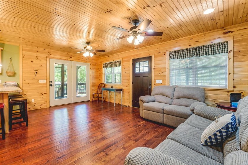 Lake living at its finest! This charming log-sided home offers - photo 13
