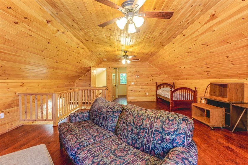 Lake living at its finest! This charming log-sided home offers - photo 15