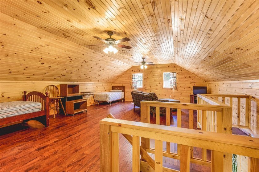 Lake living at its finest! This charming log-sided home offers - photo 17