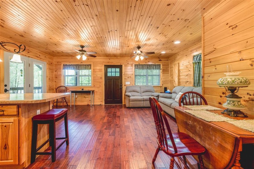Lake living at its finest! This charming log-sided home offers - photo 24