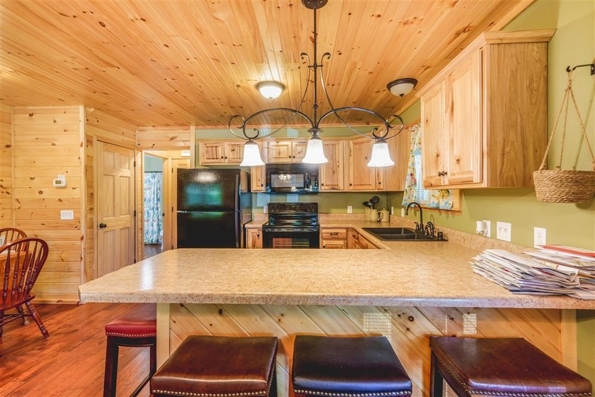 Lake living at its finest! This charming log-sided home offers - photo 32