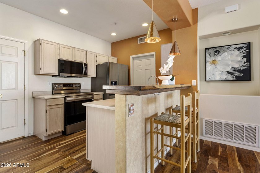Beautifully maintained second-floor condo in the highly - photo 6